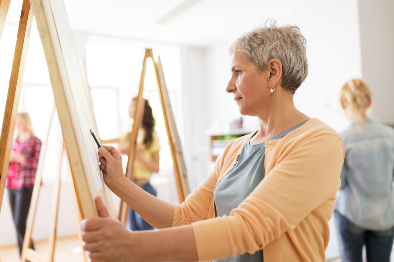 Woman painting with hand